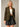 Model wearing the Cloe Corduroy Blazer Jacket in olive green featuring a tailored silhouette, notch lapels, single-button closure, flap pockets, and soft corduroy fabric, styled with a white crop top and black faux leather mini skirt.