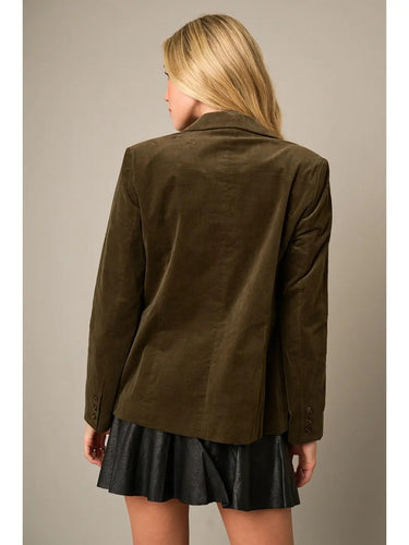 Back view of the Cloe Corduroy Blazer Jacket highlighting the tailored construction, structured shoulders, long sleeves, and rich olive corduroy fabric.