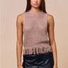 Clotet Top sleeveless neutral crochet-style top worn with black ruffle shorts, showing open-knit texture, straight fit, and fringe hem.