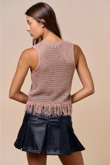 Clotet Top back view showing sleeveless crochet texture, neutral tone, and relaxed fit with fringe hem.