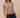 Clotet Top front view highlighting breathable open-knit fabric, soft taupe color, and subtle boho fringe detail.