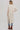 Beige longline cardigan with side slits styled casually with denim shorts – Matte Clothing