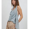 Side view of the Cristine polka dot halter top.