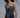 Model wearing Crystal Embellished Corset Top in black with silver crystals, styled with jeans and accessories.
