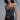 Model wearing Crystal Embellished Corset Top in black with silver crystals, styled with jeans and accessories.