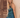 Model wearing teal sequin Daria Jumpsuit with halter neckline and side slit — Matte Concept Store
