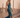Model wearing teal sequin Daria Jumpsuit with halter neckline and side slit — Matte Concept Store
