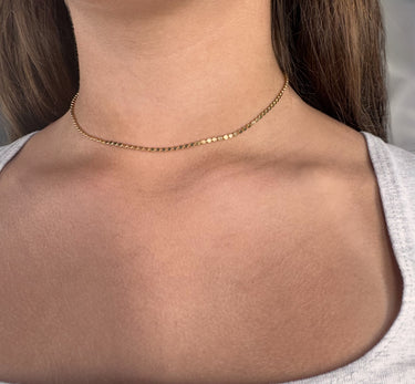 Model wearing Dots Necklace by Matte, delicate gold filled beaded chain necklace close-up
