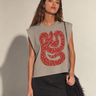 Model wearing the Drumar Graphic Tee in mocha showcasing the oversized vintage snake graphic, cropped relaxed fit, structured shoulders, and casual everyday styling.