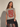 Model wearing the Drumar Graphic Tee in mocha showcasing the oversized vintage snake graphic, cropped relaxed fit, structured shoulders, and casual everyday styling.