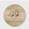 Duke Hair Clip with two silver star shapes adorned with pearls on light wood background, elegant accessory photo for Matte.