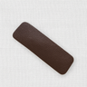 Ego Hair Clip in brown eco-leather on white background, minimalist accessory photo for Matte.