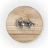 Silver star-shaped brooch on a wooden circular platform with a white background