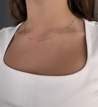Model wearing Encanto gold plated chain necklace by Matte, fine minimalist jewelry