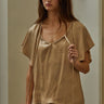 Etta Blouse front view showing soft tie neckline and lightweight flowy fit in warm neutral tone.