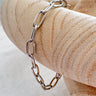 Silver Fatman Bracelet with bold chain links by Matte on wooden display