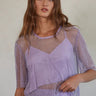 Model wearing the Fishnet Top in lilac shimmer mesh with matching cropped cami.