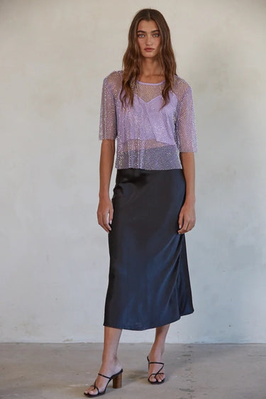 Full-length styling of the Fishnet Top paired with a midi skirt.