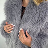 Close-up of the Frost Gray Luxe Jacket showing its plush gray faux-fur texture and voluminous silhouette.