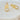 Gaia stud earrings by Matte, gold plated hypoallergenic paperclip design with cubic zirconia accents on stone background