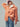 Front view of the Genova oversized corduroy jacket featuring the relaxed silhouette, structured collar, and soft peach corduroy texture.