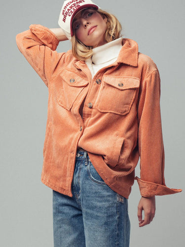 Front view of the Genova oversized corduroy jacket featuring the relaxed silhouette, structured collar, and soft peach corduroy texture.