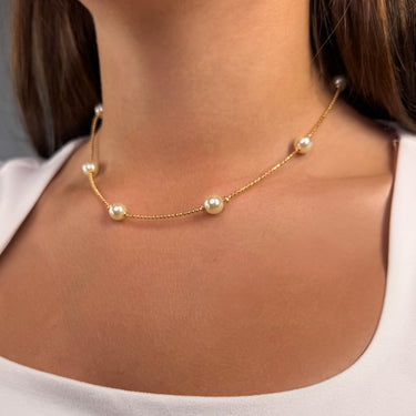 Model wearing Genyen gold filled necklace with pearls close-up