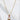 Gleam Necklace by Matte, gold plated padlock pendant on delicate chain, shown on sculptural white background