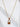 Gleam Necklace by Matte, gold plated padlock pendant on delicate chain, shown on sculptural white background