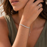 Model wearing the Godiv Bracelet featuring brilliant simulated diamonds on an adjustable chain.