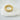 "Gold Voile ring with rectangular cut stones on marble base"
