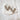 gold platted silver earrings display over marmot