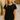 Model wearing the Gustavia T-Shirt — black cotton short-sleeve tee with classic round neckline, styled with jeans outdoors in natural light.
