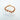 A beaded bracelet with gold plated elements and brown beads, displayed on a white marble surface by Matte