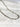 Halo Necklace by Matte, silver rectangular link chain on white marble surface