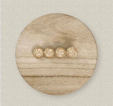 Set of crystal hair clips in gold tones on wood background – Viola Hair Clip by Matte.