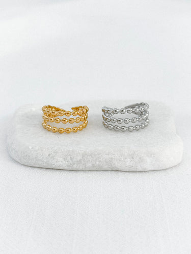 Gold and silver beaded rings on marble base – Jamaica Ring by Matte.