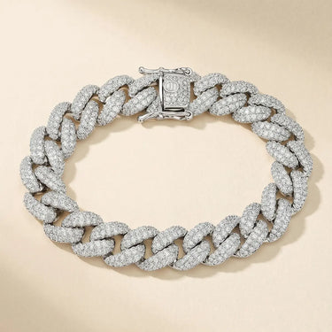 Silver Jawa Bracelet displaying bold Cuban curb links fully covered with sparkling cubic zirconia, arranged in a circular shape.