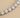 Joric Necklace close-up detail of sparkling simulated diamond tennis necklace setting.