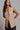 Kaia Vest beige sleeveless tailored vest with structured lapels and front button closure.