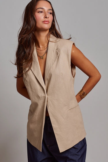 Kaia Vest beige sleeveless tailored vest with structured lapels and front button closure.