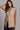 Kaia Vest beige tailored vest styled with wide-leg trousers.