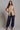 Kaia Vest beige vest worn as a modern layering piece.