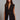 Kaia Vest black longline tailored vest styled with white trousers.