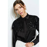 Keira Sequin Blouse by Matte – black satin sequin blouse styled with tailored trousers for evening look