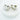 Pair of silver-plated Kira Hoop Earrings displayed on a white marble slab.