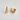 Kira Hoop Earrings featuring polished gold-plated sculptural hoop earrings with a teardrop silhouette, smooth mirror finish, lightweight hollow design, secure post-back closure, and modern statement style, displayed on a soft white background.