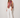 Kirby Top colorful floral scarf-style top with fringe trim styled with white wide-leg pants front view.