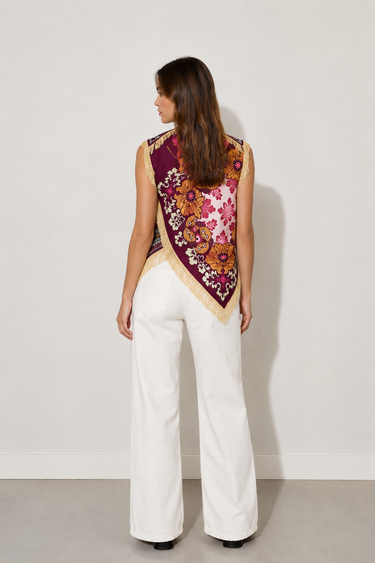 Kirby Top asymmetrical floral print statement top with fringe detailing back view.
