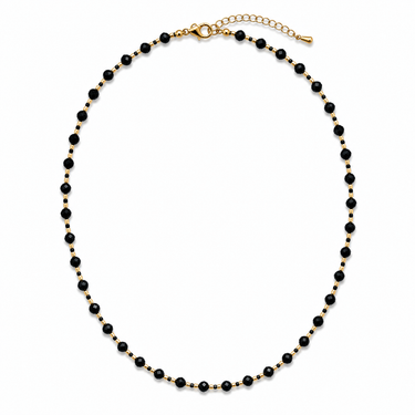 Laia Necklace black faceted beaded necklace with gold-tone accents on white background.